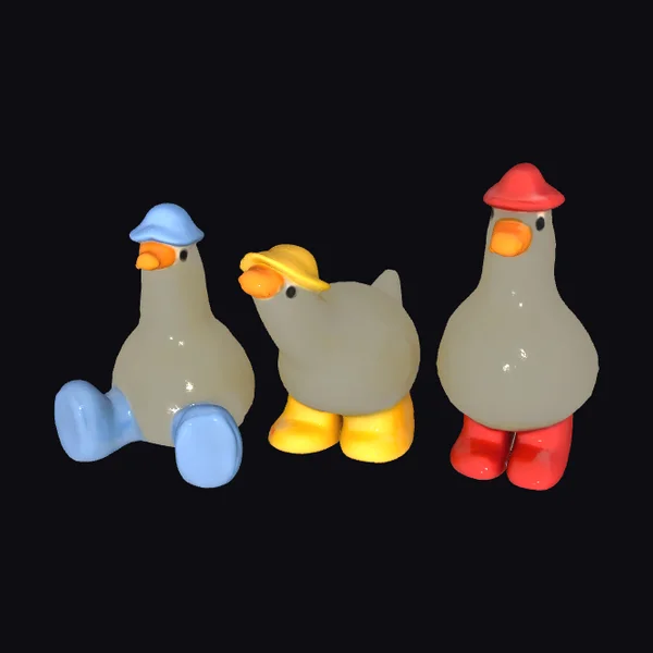 Three Hatted Duck Figurines